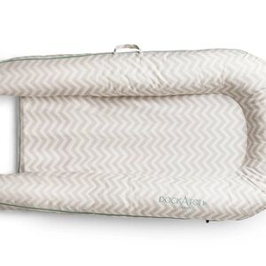 The DockATot Grand Dock - brand new. Never even taken out of the bag.